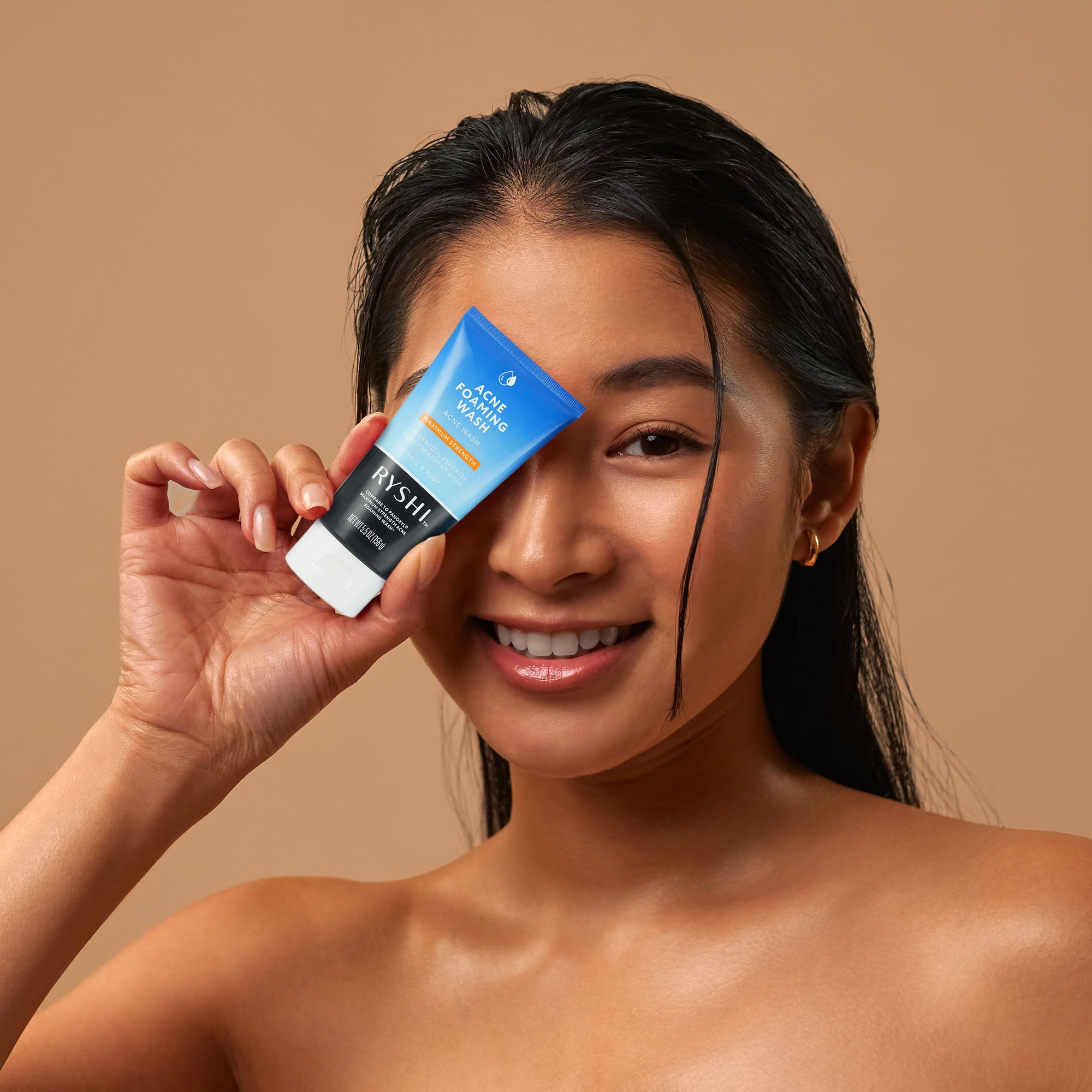 Application of Maximum Strength Acne Foaming Wash on skin