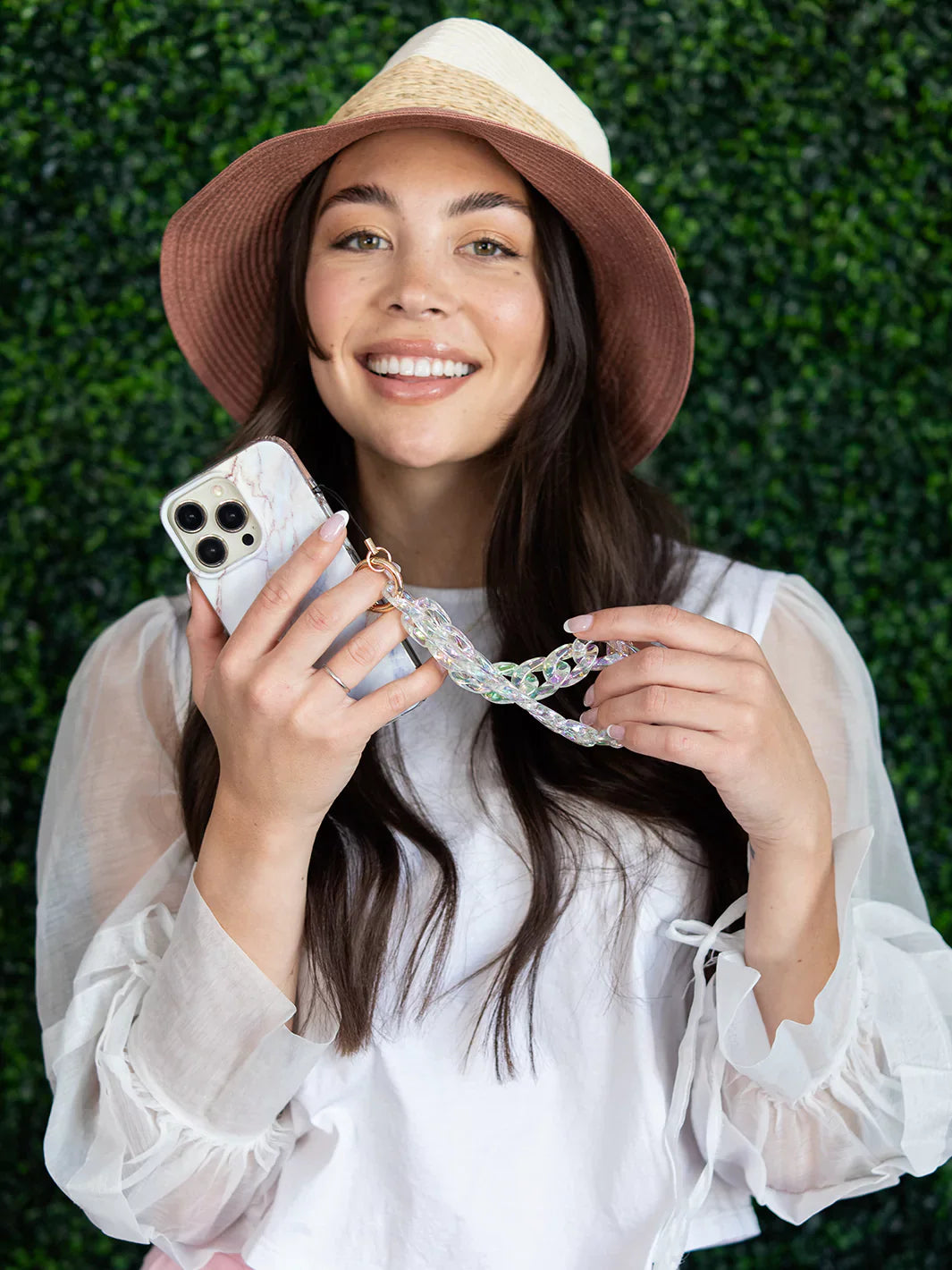 Lifestyle shot of Glamorous Holographic Phone Wristlet Charm in use