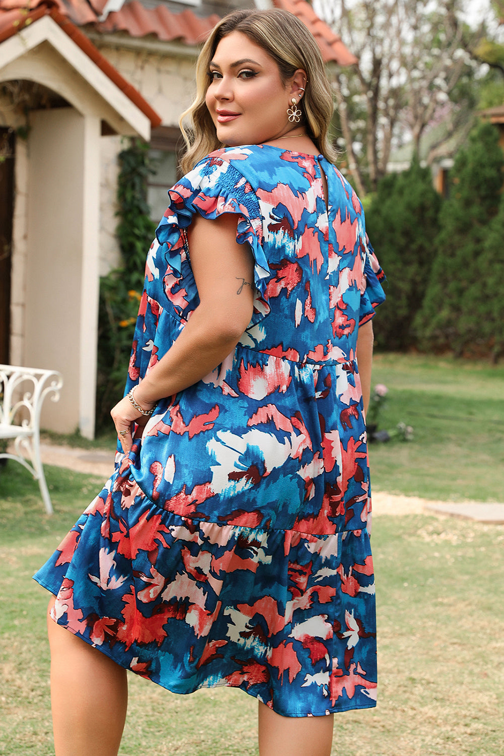 Side view showcasing the vibrant abstract print of the dress