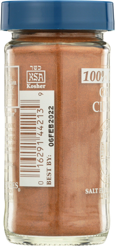 Close-up of Morton & Bassett Organic Ground Cinnamon in a rustic spoon