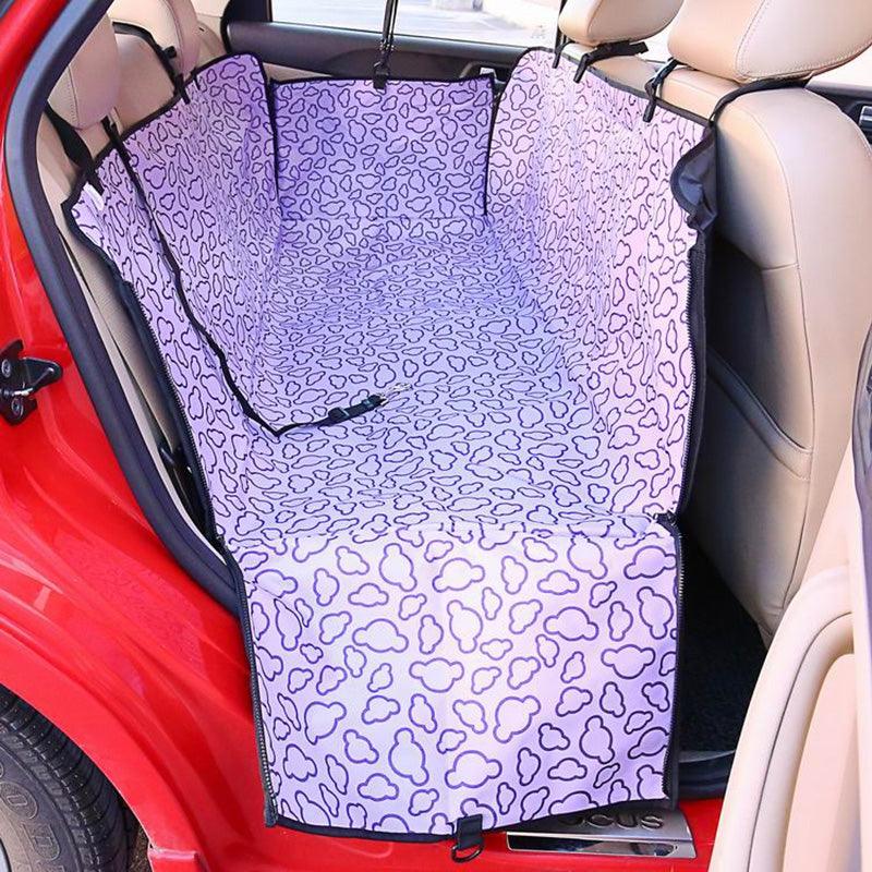 PetSafe Car Hammock Seat Cover in a car with a dog resting comfortably