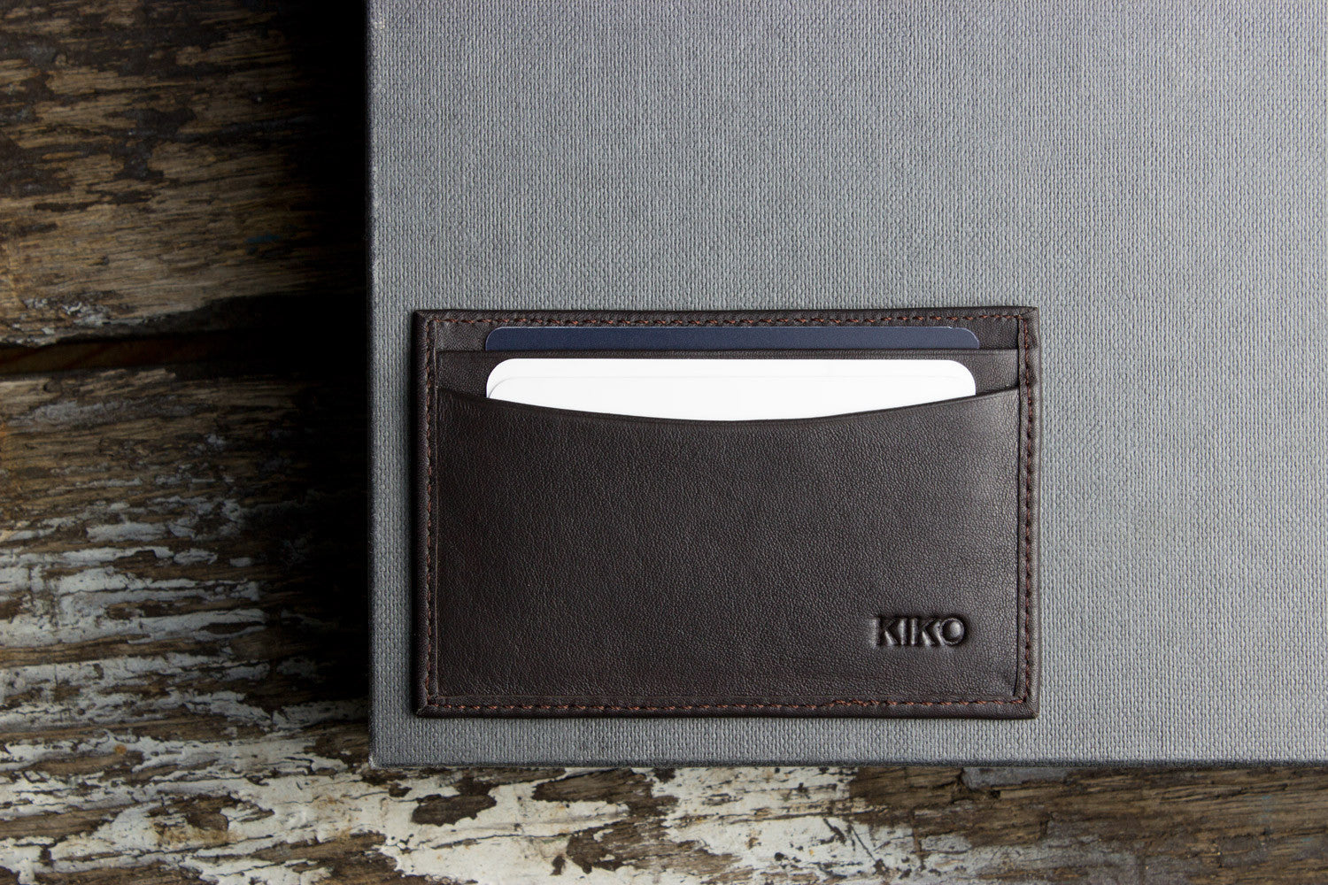 Elegant Premium Leather Card Case placed on a stylish desk with office essentials