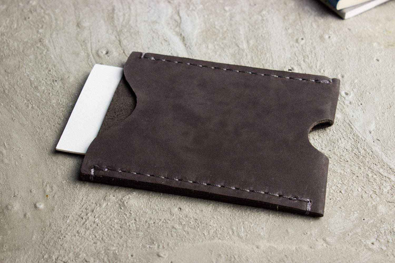Compact and stylish Kiko Cowhide Leather Card Holder on a table