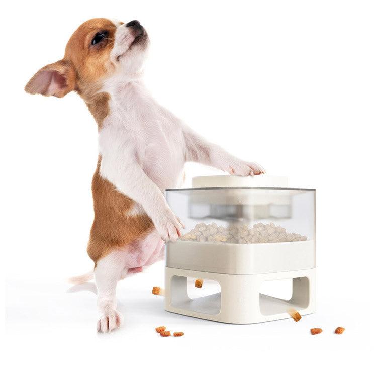 Interactive Dog Food Dispenser Toy on a grassy field with dog