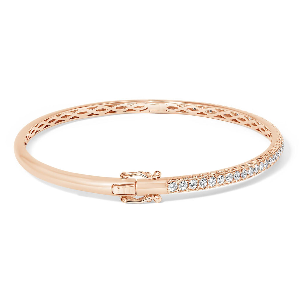 Lifestyle image of a woman wearing 14K Gold Half Eternity Diamond Bangle Bracelet