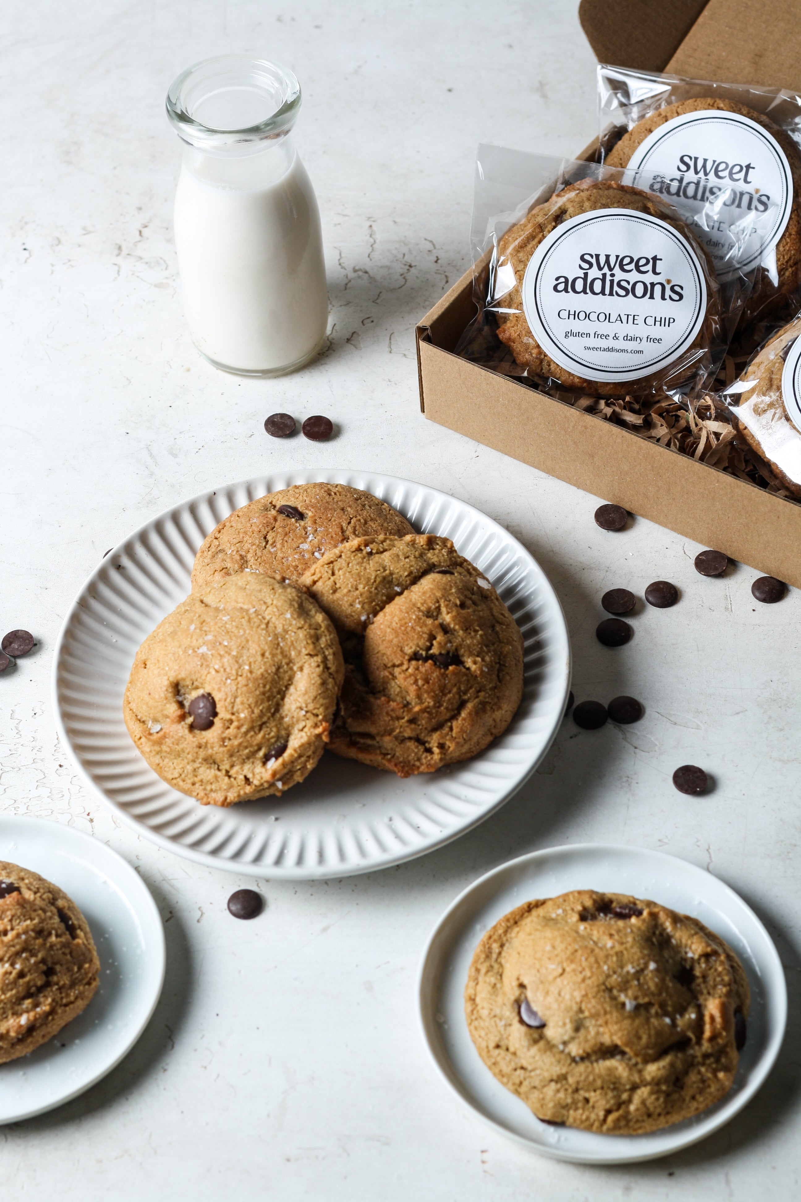 Packaging of Sweet Addison's gluten-free chocolate chip cookies in a natural setting