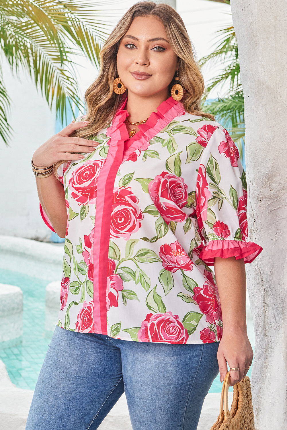 Side view showcasing ruffled sleeves of Elise Plus Size Floral Blouse