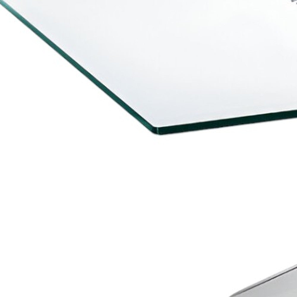 Close-up of Silver Steel Cross Legs of 47" Clear Glass Coffee Table