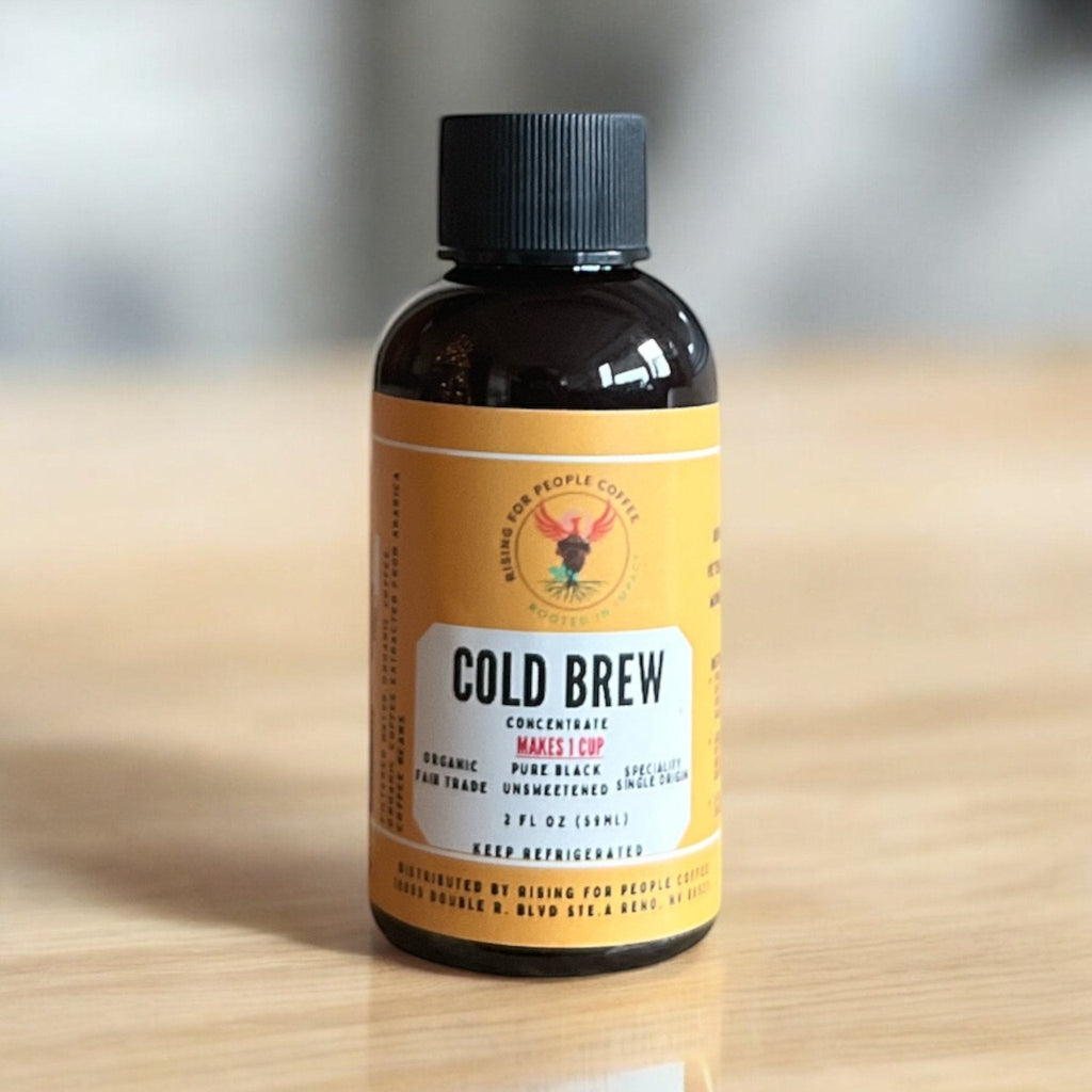 Front view of Organic Cold Brew Coffee Concentrate in 2oz bottle by Rising For People Coffee Co.
