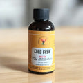 Front view of Organic Cold Brew Coffee Concentrate in 2oz bottle by Rising For People Coffee Co.