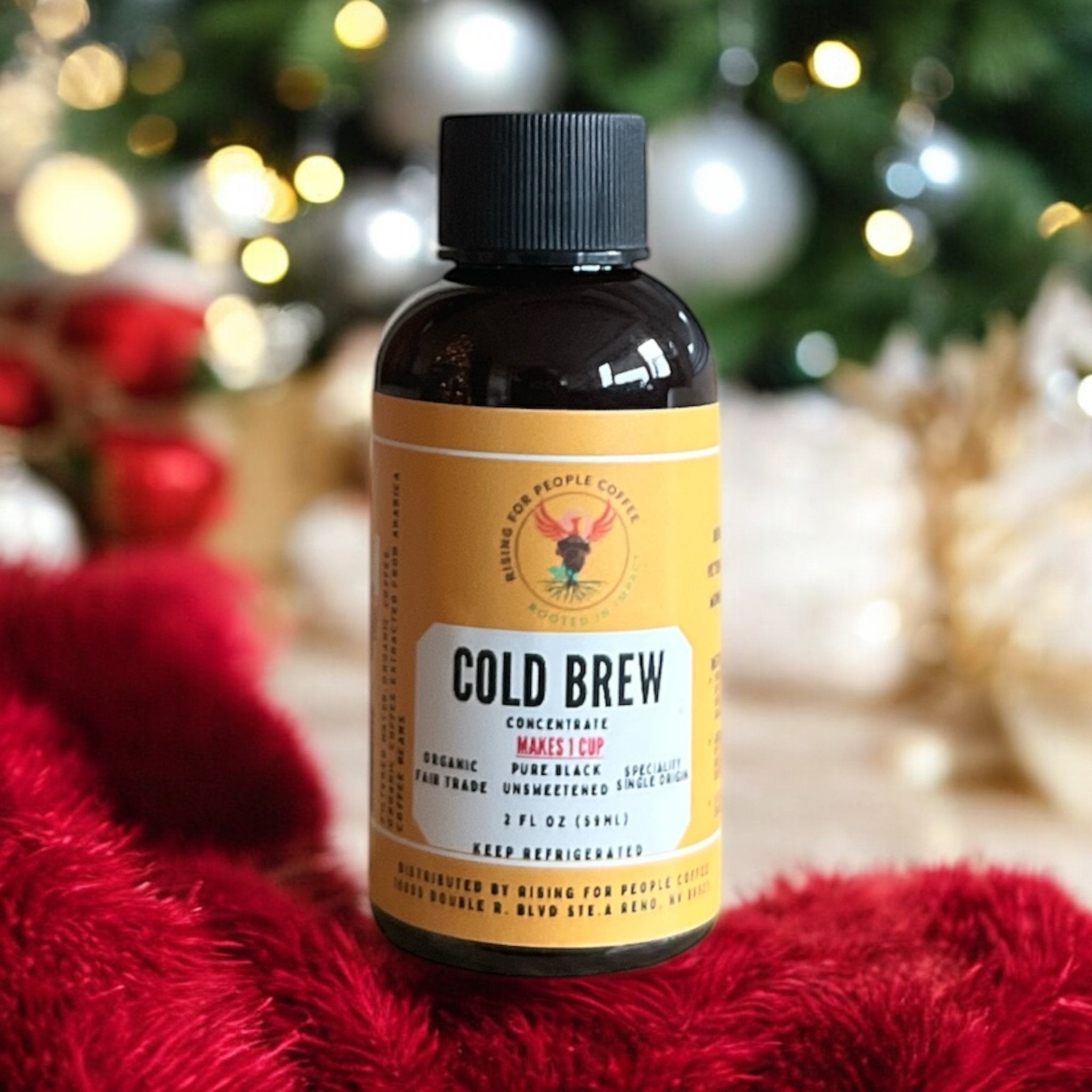 Pouring Organic Cold Brew Coffee Concentrate into a glass filled with ice.