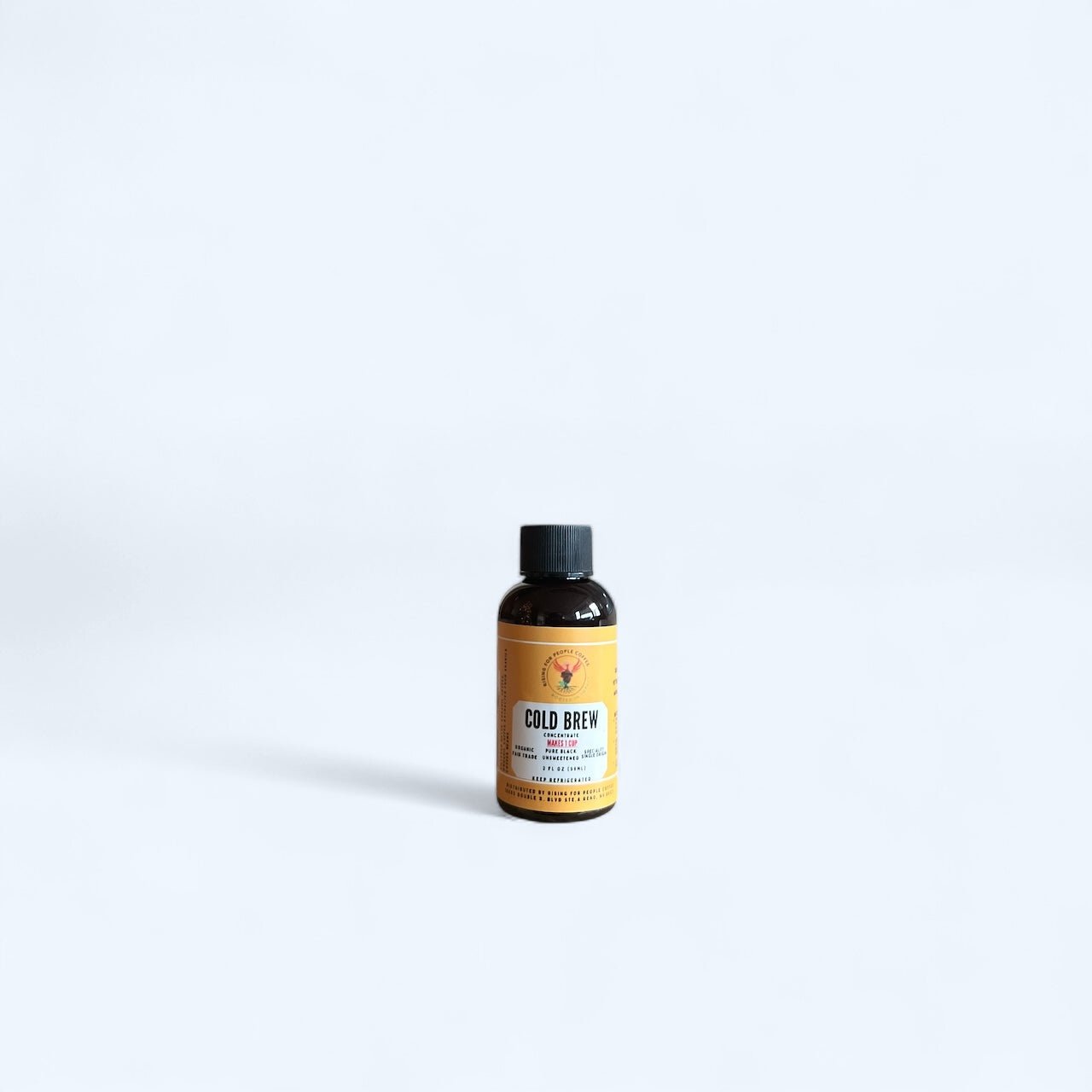 Lifestyle image of Organic Cold Brew Coffee Concentrate on a picnic table.