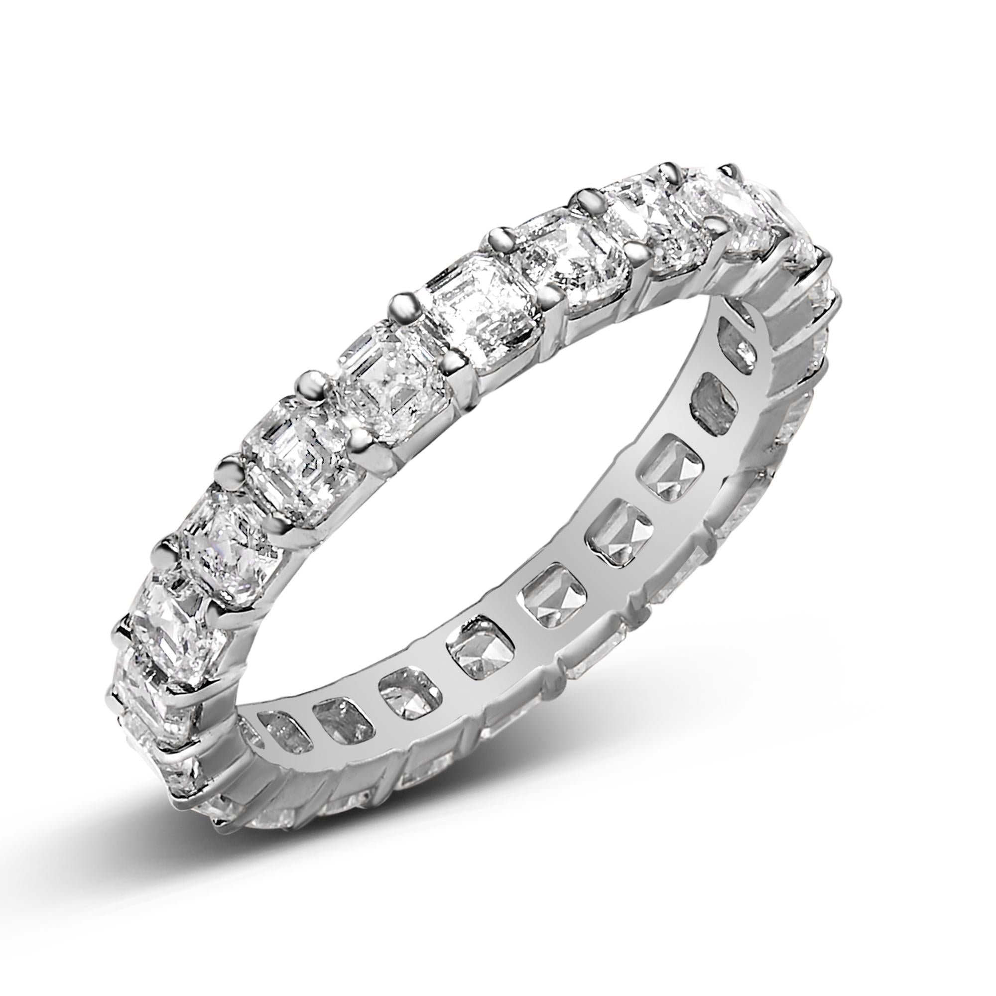 Close-up of sparkling Asscher cut diamonds in 14K White Gold band