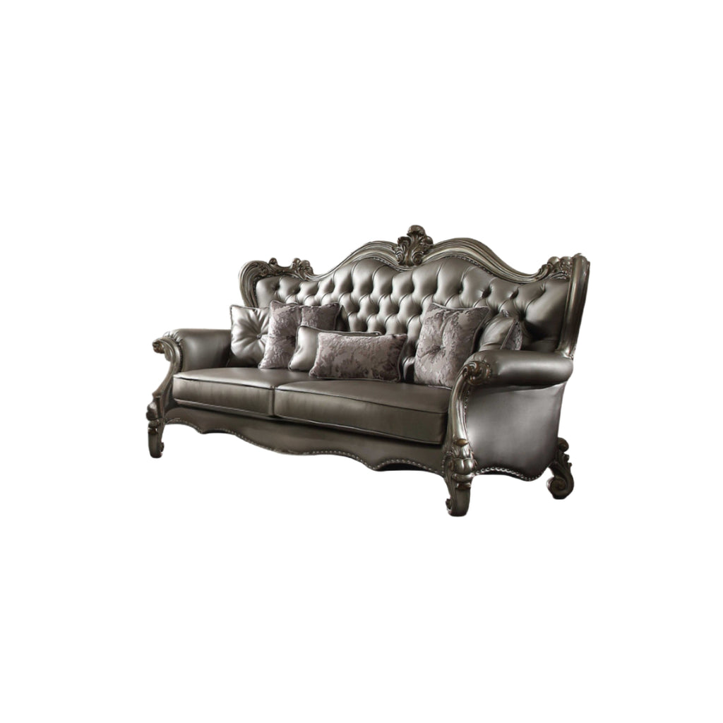 Side angle of the 46" Platinum Faux Leather Curved Sofa showcasing nailhead trim