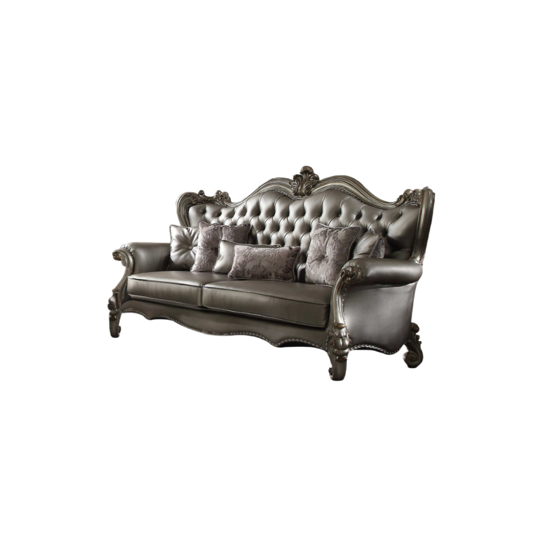 Side angle of the 46" Platinum Faux Leather Curved Sofa showcasing nailhead trim