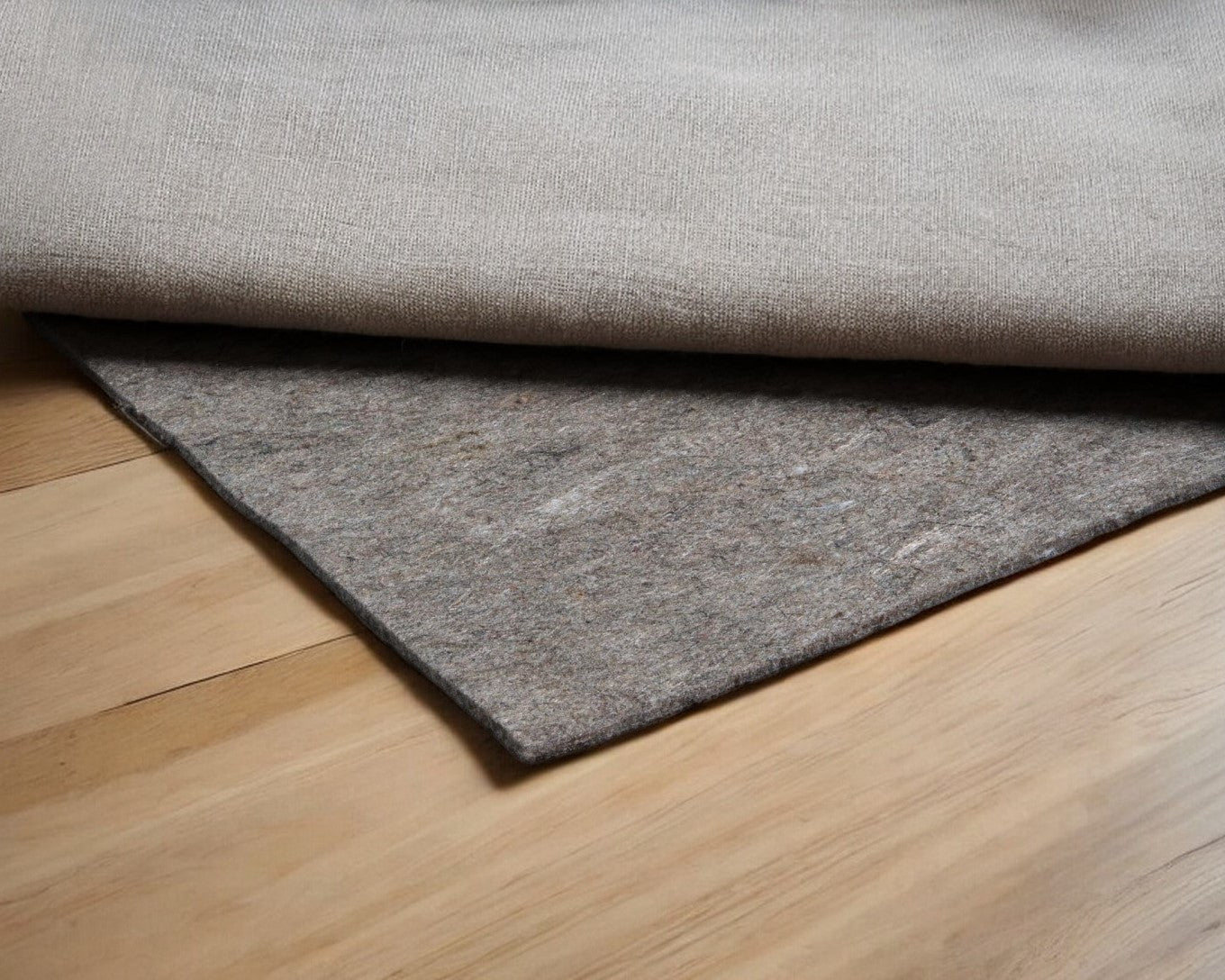 Living room setting with Ultimate 8' x 10' Rug Pad in gray