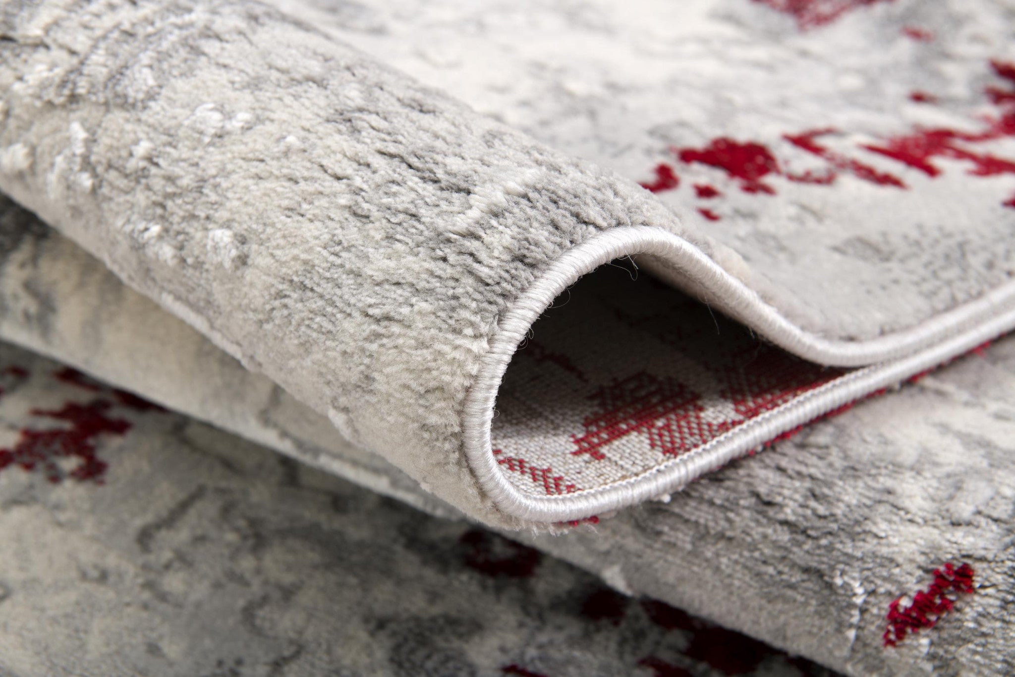 Colorful abstract design of 9' x 13' Red and Gray Area Rug