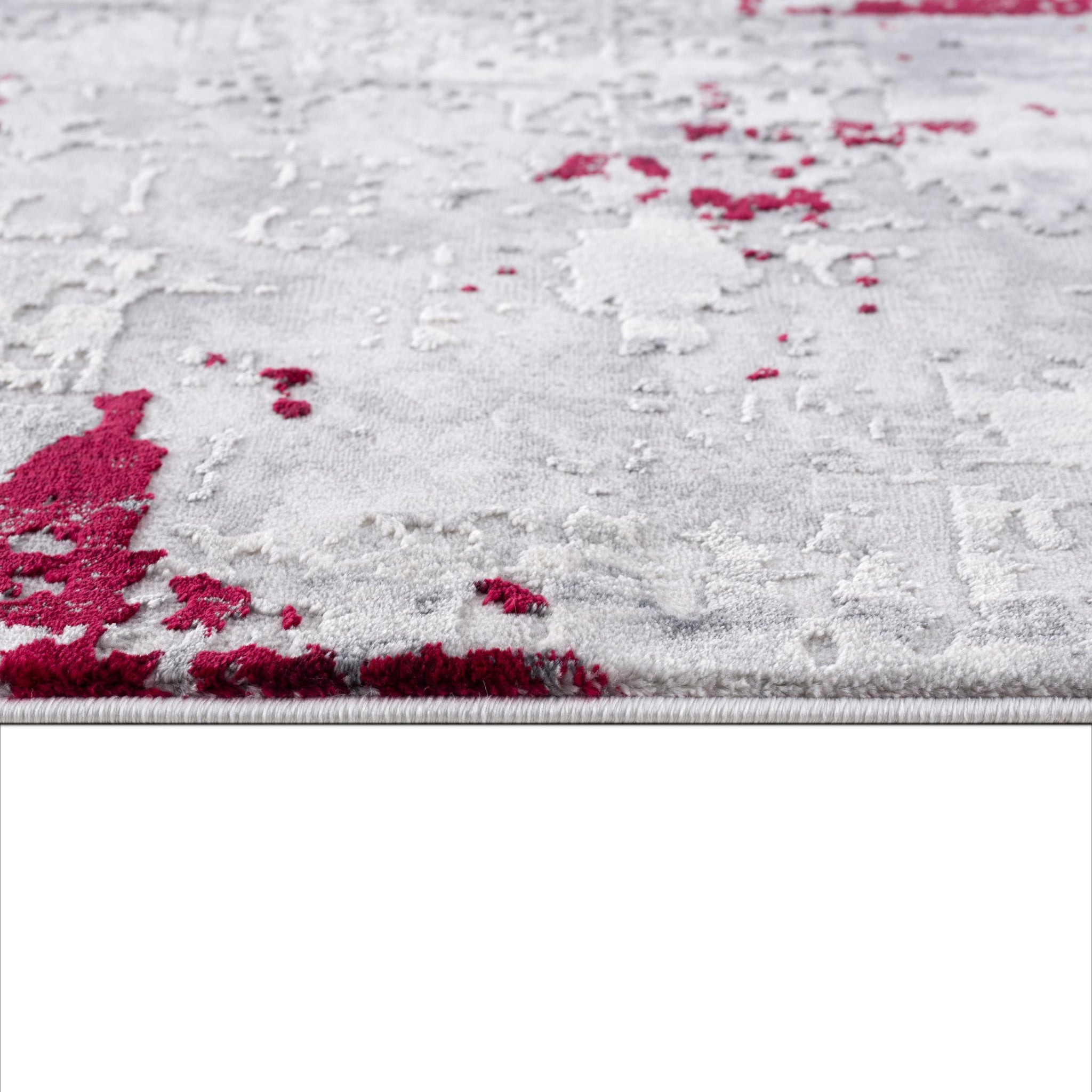 Side view showcasing texture of 9' x 13' Red and Gray Abstract Area Rug