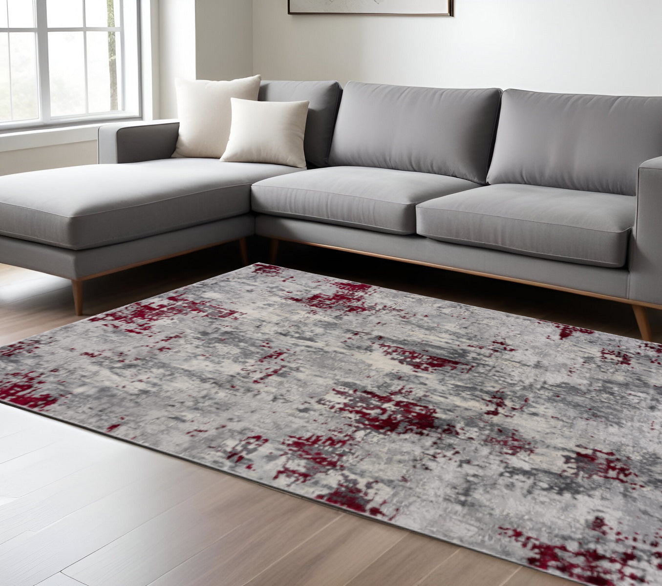 Lifestyle shot of 9' x 13' Red and Gray Abstract Area Rug in modern living room
