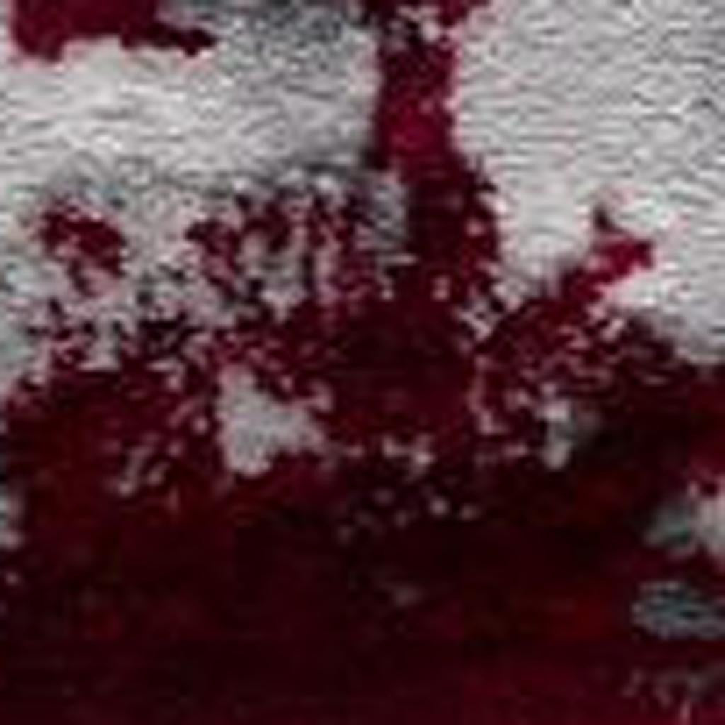 Showing the durability of 9' x 13' Red and Gray Abstract Area Rug