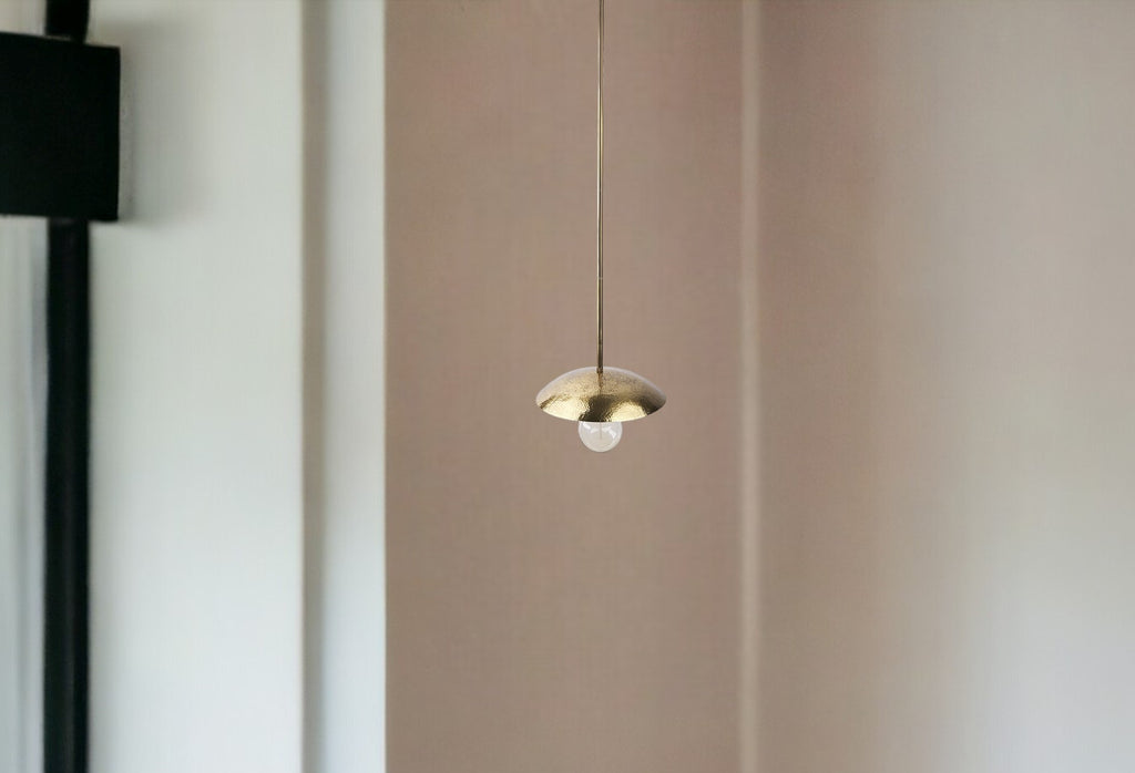Installation of the Industrial Hammered Gold Pendant Light in a kitchen