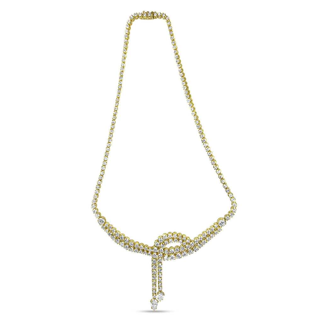 Pear-shaped diamond tips of the 14k Yellow Gold Lariat Necklace
