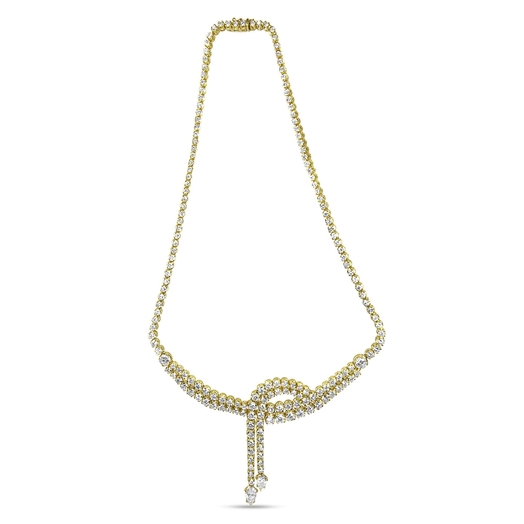 Pear-shaped diamond tips of the 14k Yellow Gold Lariat Necklace