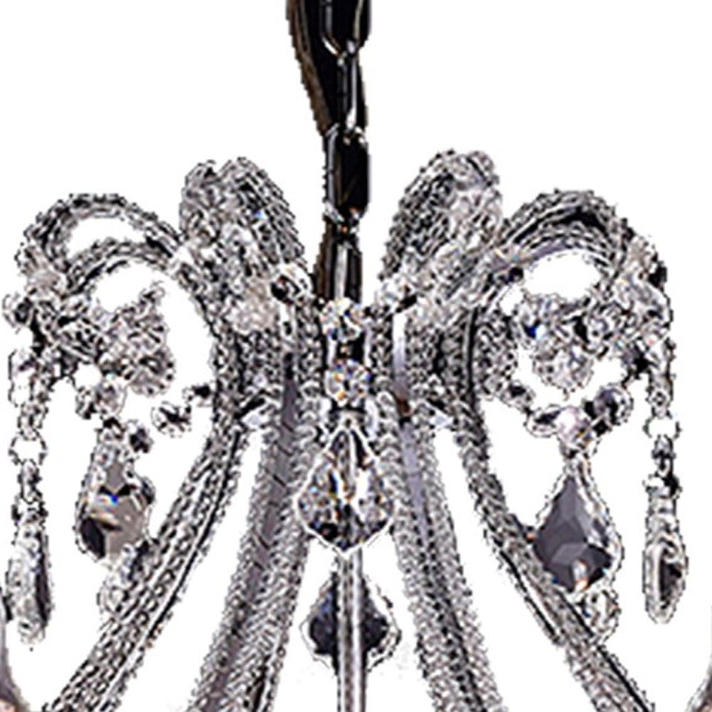 Room setting with the Eight-Light LED Chandelier illuminating the dining area