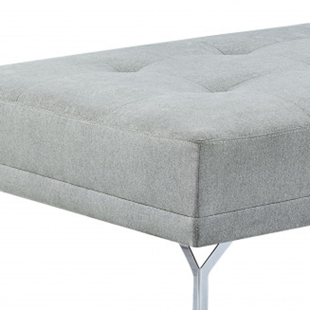 Side view of stylish 74 inch gray velvet sofa with black legs