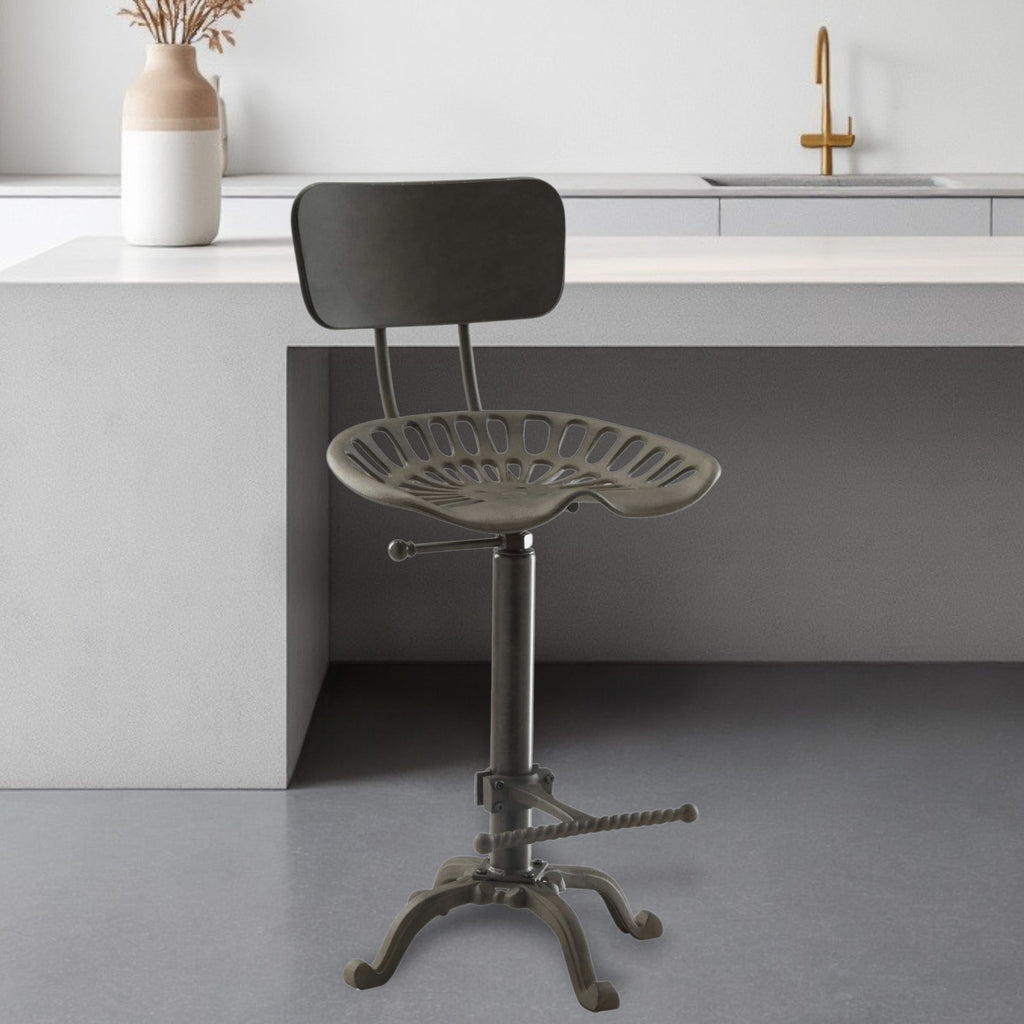 Close-up of the bucket seat design of the Gray Iron Bar Chair