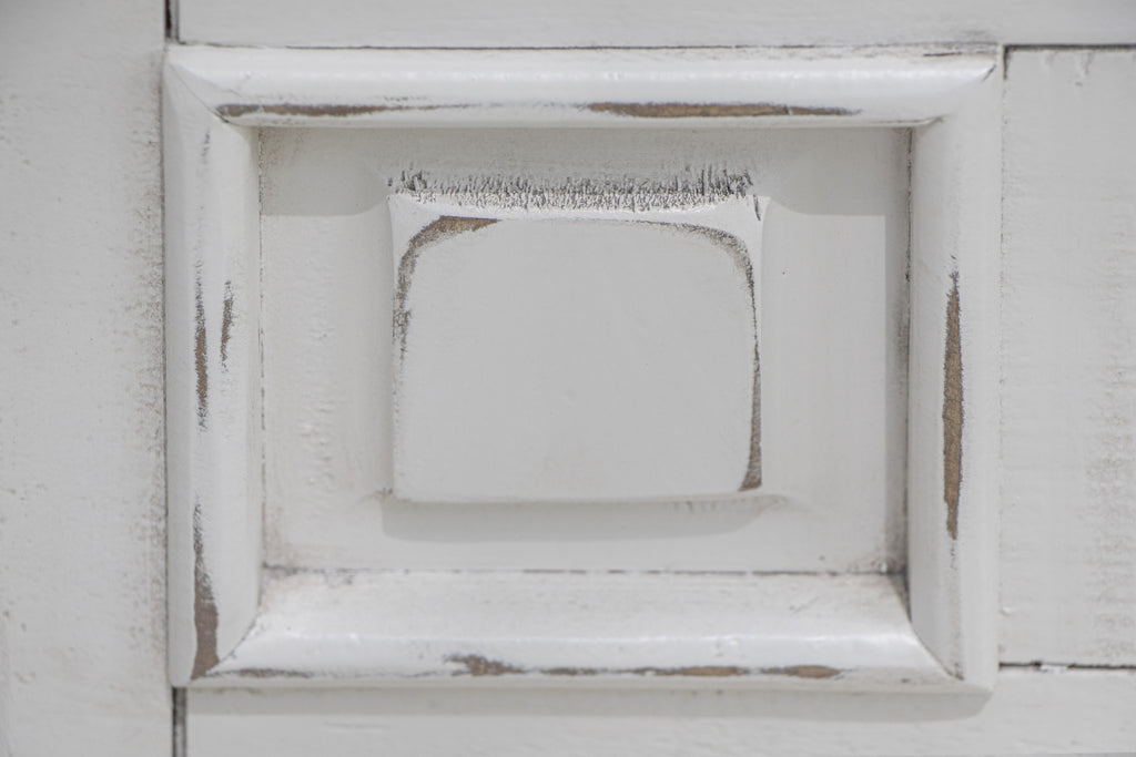 Side angle of the 69" White Solid Wood Triple Dresser showcasing drawers