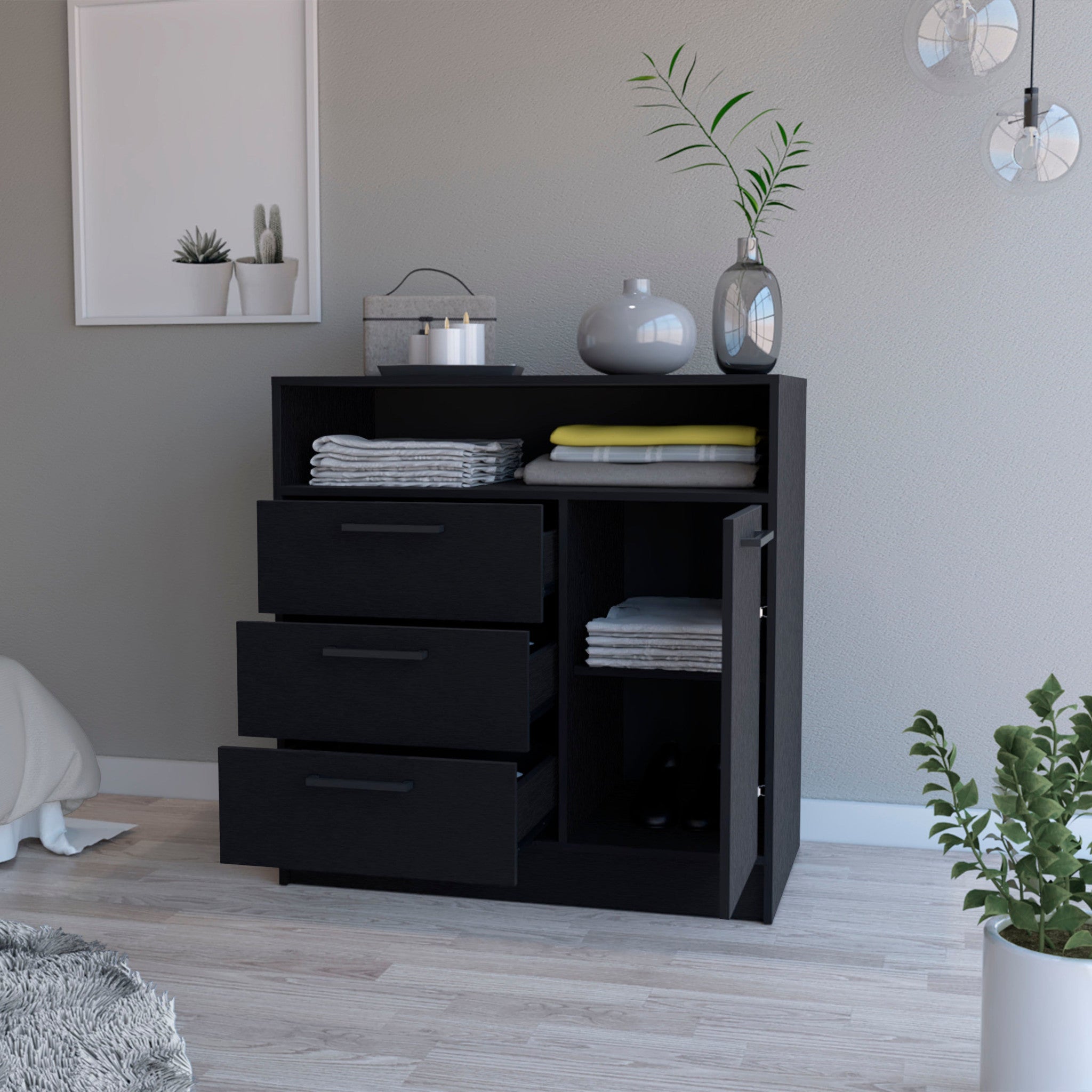 Lifestyle image of the 35-inch black three drawer dresser in a stylish bedroom
