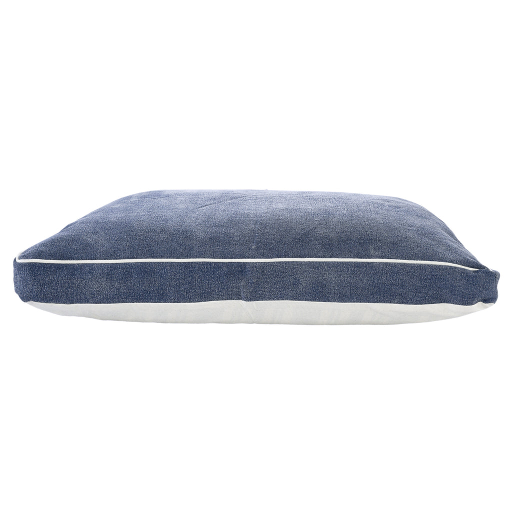 Luxurious Stonewashed Blue Dog Bed placed in a stylish living room
