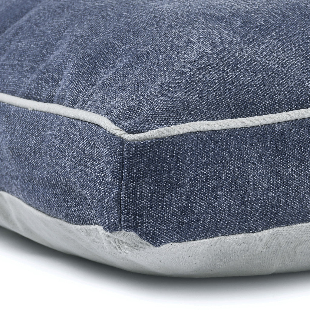 Side view showcasing the plush filling of Luxurious Stonewashed Blue Dog Bed