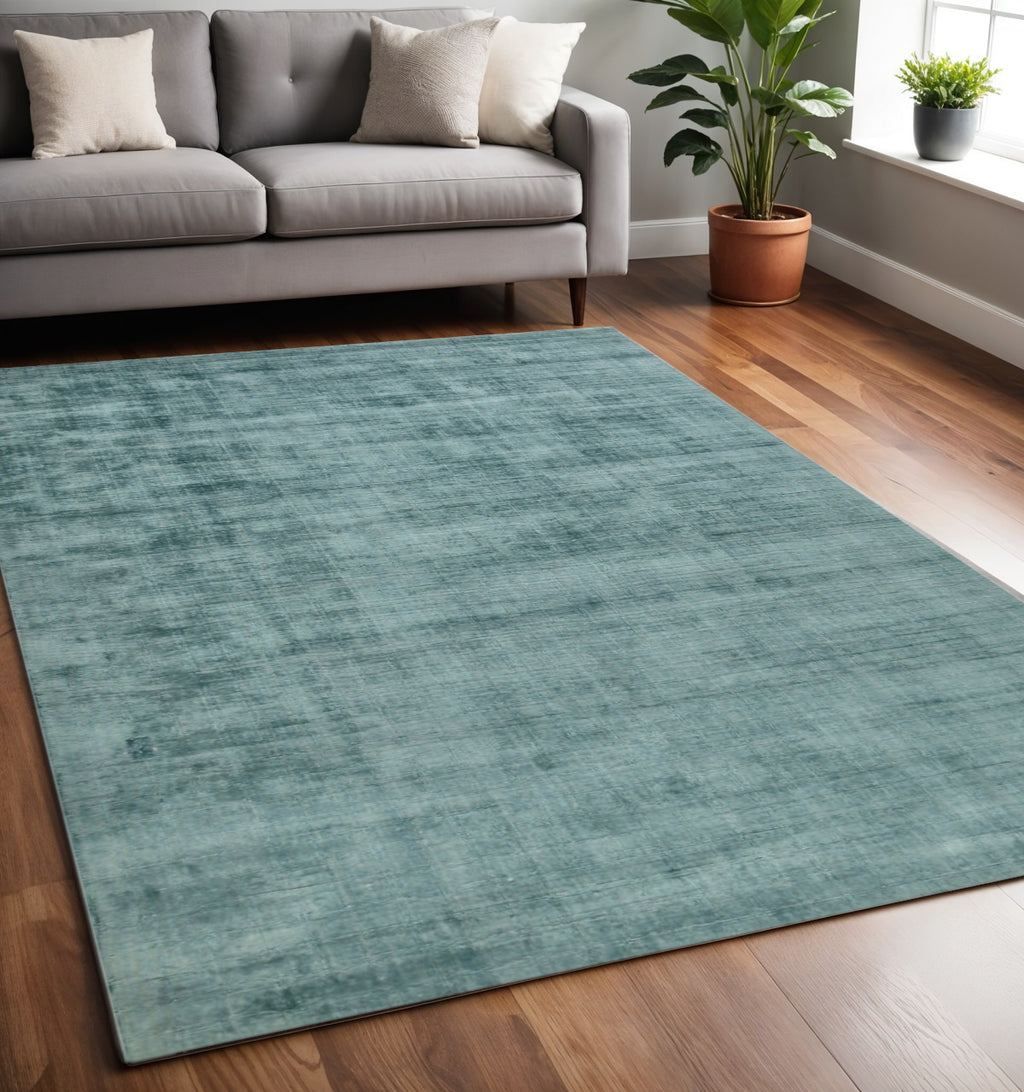 Versatile 5' x 8' Sea Green and Light Blue Hand Woven Area Rug in modern interior by Homeroots