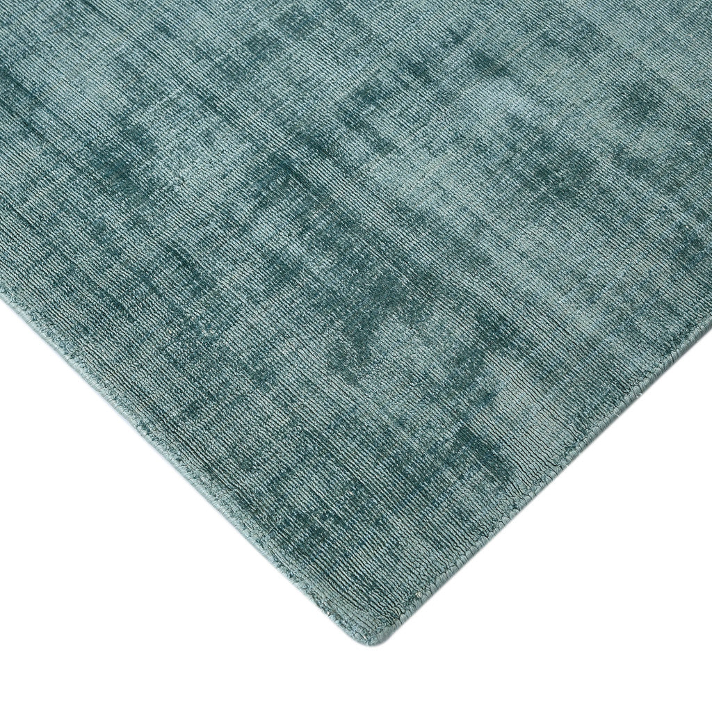 Elegant dining area with 5' x 8' Sea Green and Light Blue Hand Woven Area Rug by Homeroots