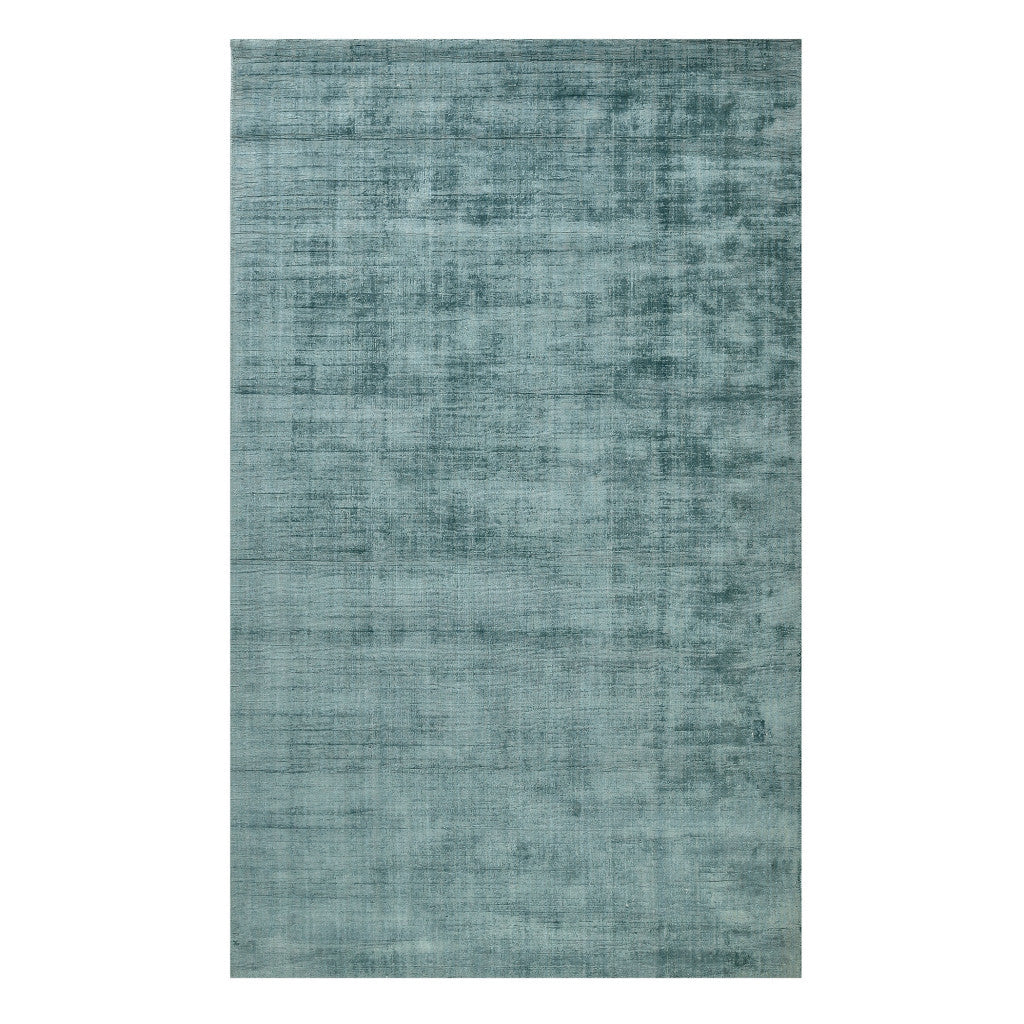Living room featuring 5' x 8' Sea Green and Light Blue Abstract Hand Woven Area Rug by Homeroots