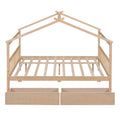 Elegant natural wood full canopy bed frame with drawers in a bedroom setting