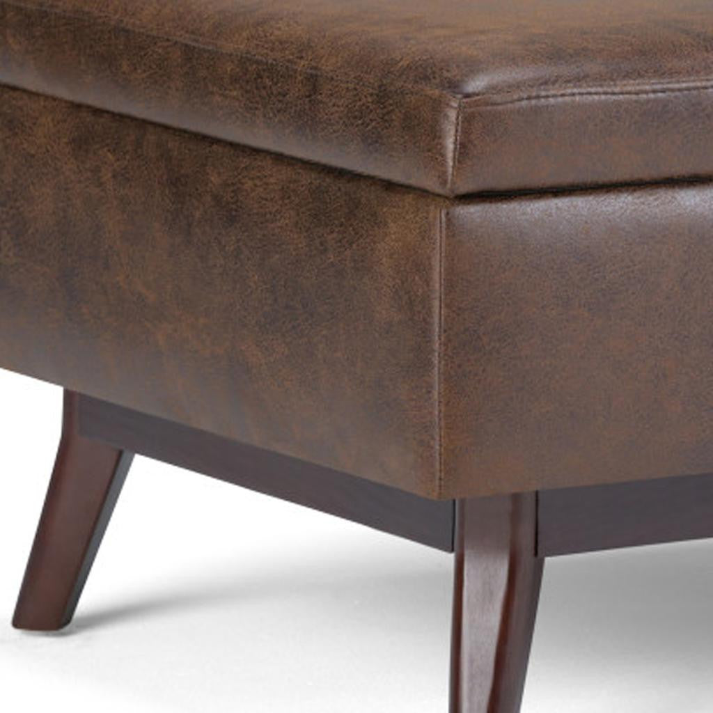 Storage compartment of Brown Leather Cocktail Ottoman revealed