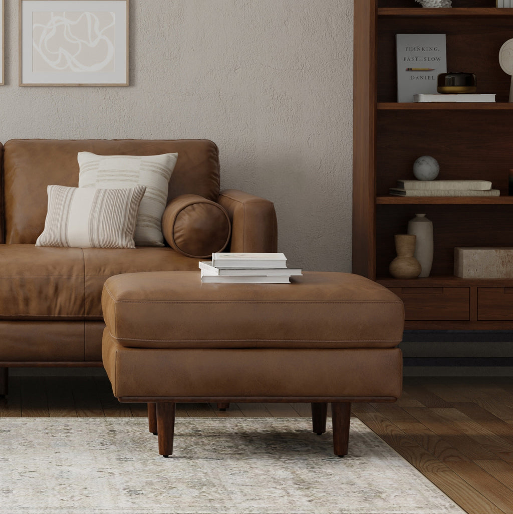 Stylish corner with 33-inch brown leather cocktail ottoman and decor
