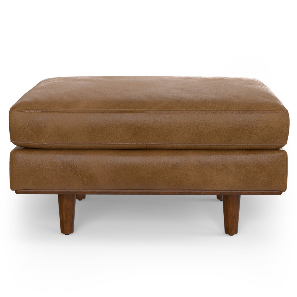 Cozy living room featuring 33-inch brown leather cocktail ottoman