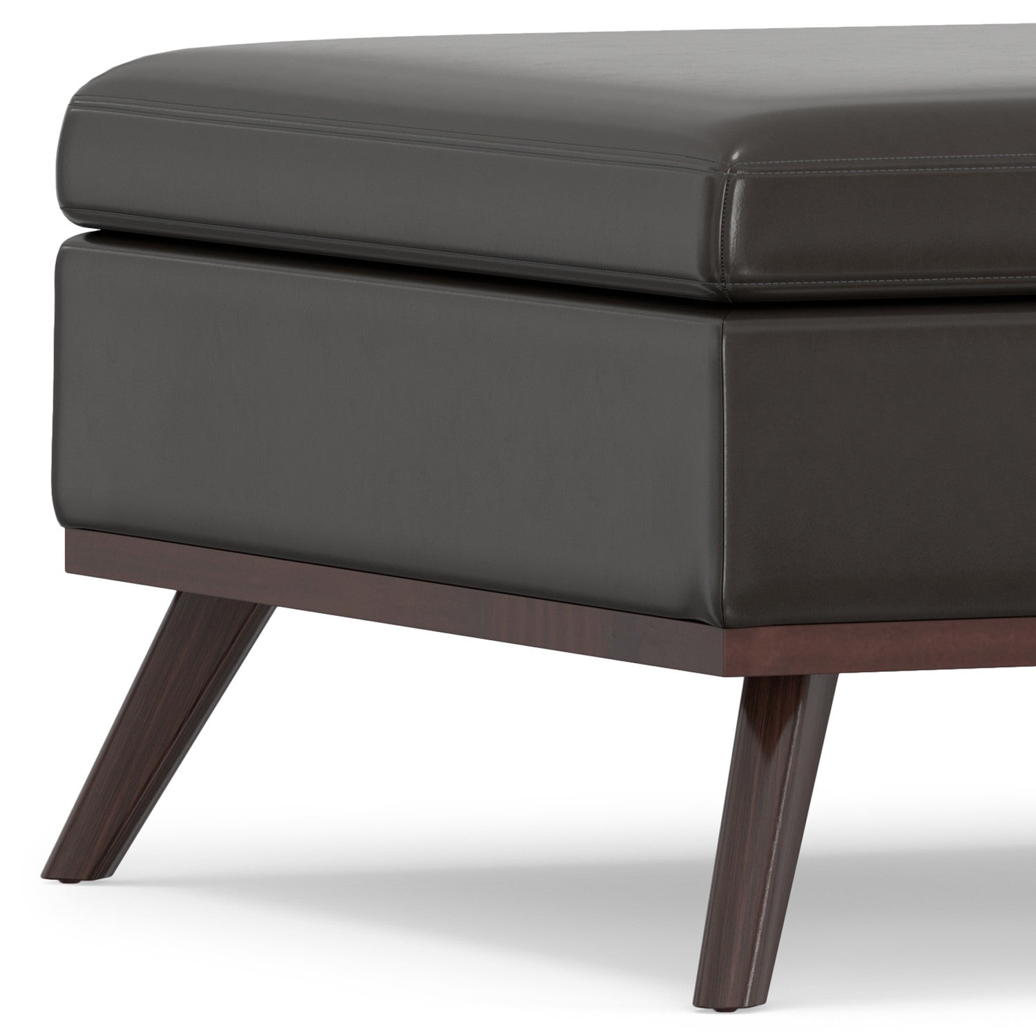Close-up of the rich brown leather texture on the Cocktail Ottoman by Homeroots
