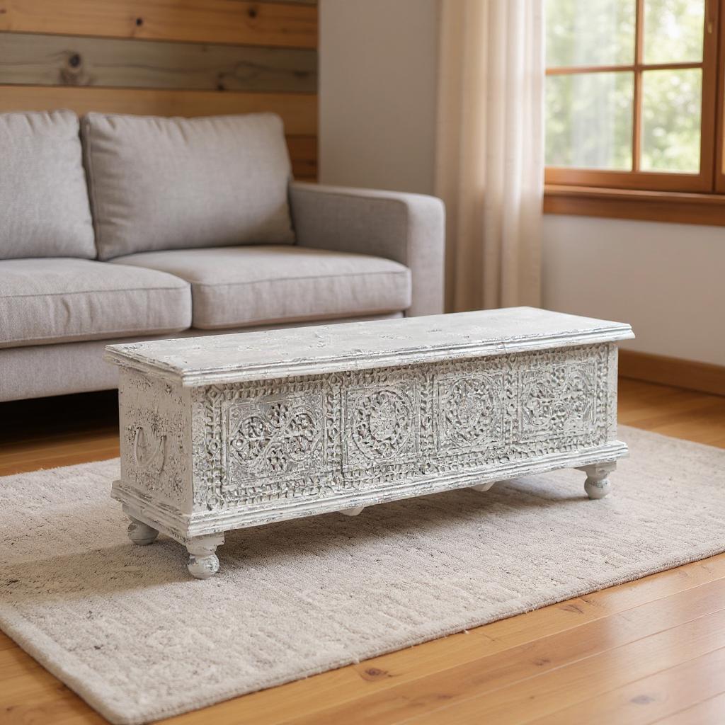Lifestyle image of the 54" White Solid Wood Medallion Storage Ottoman in a living room