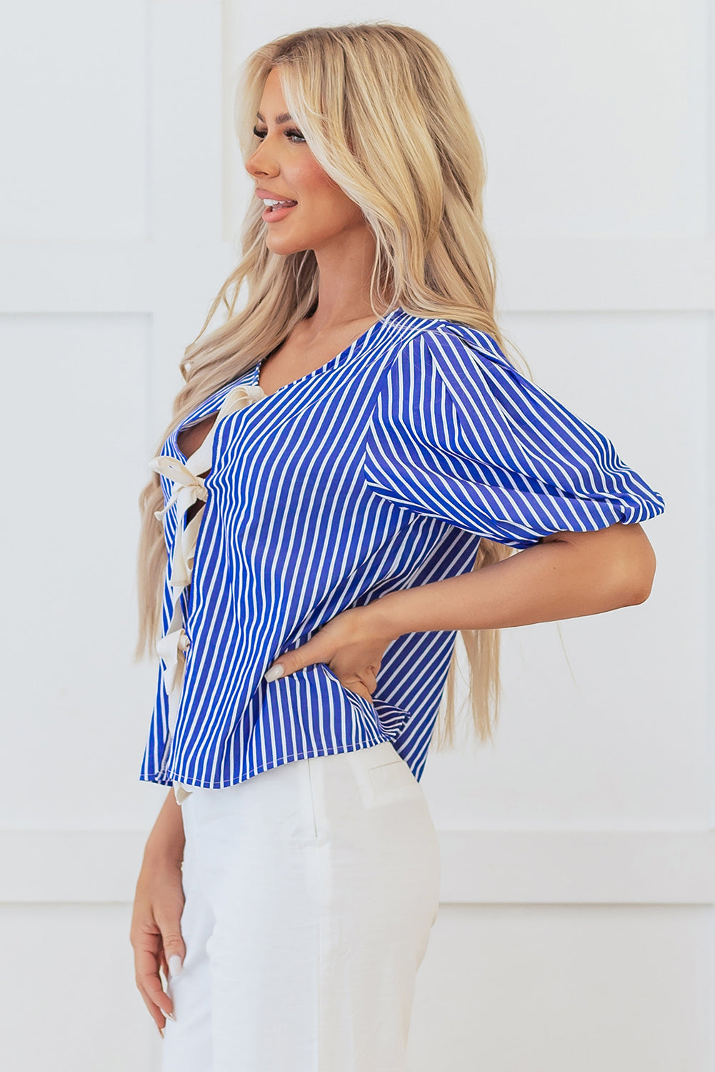 Back view of Chic Striped Tied Front Blouse highlighting bow tie detail