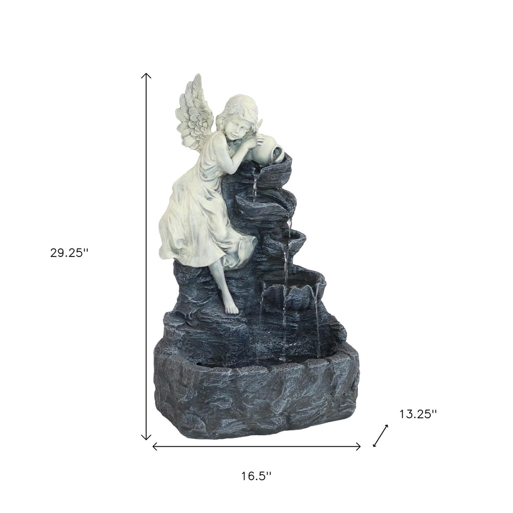 Side angle of 29-Inch Gray Polyresin LED Garden Art in outdoor setting