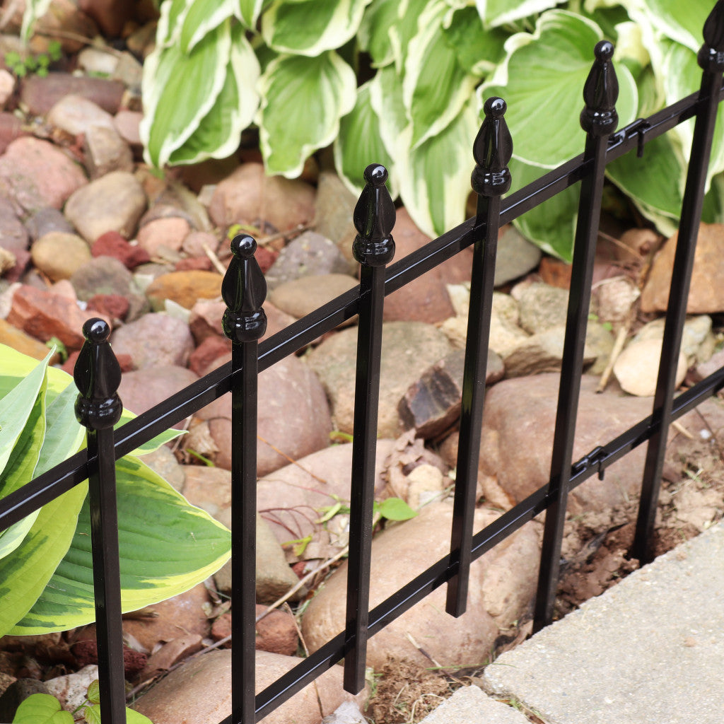 Elegant Black Iron Garden Stake against a vibrant garden backdrop