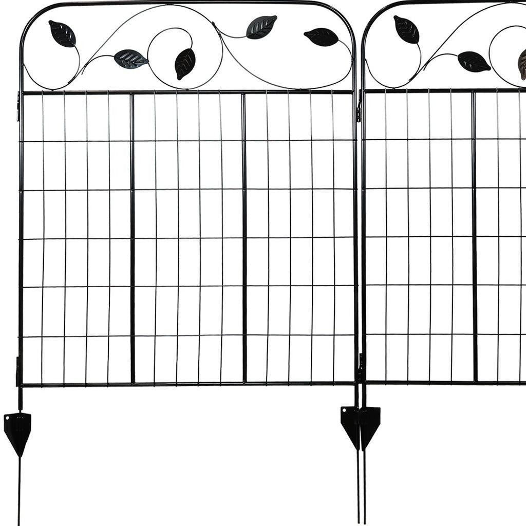 Stylish black steel garden stake in a vibrant garden setting