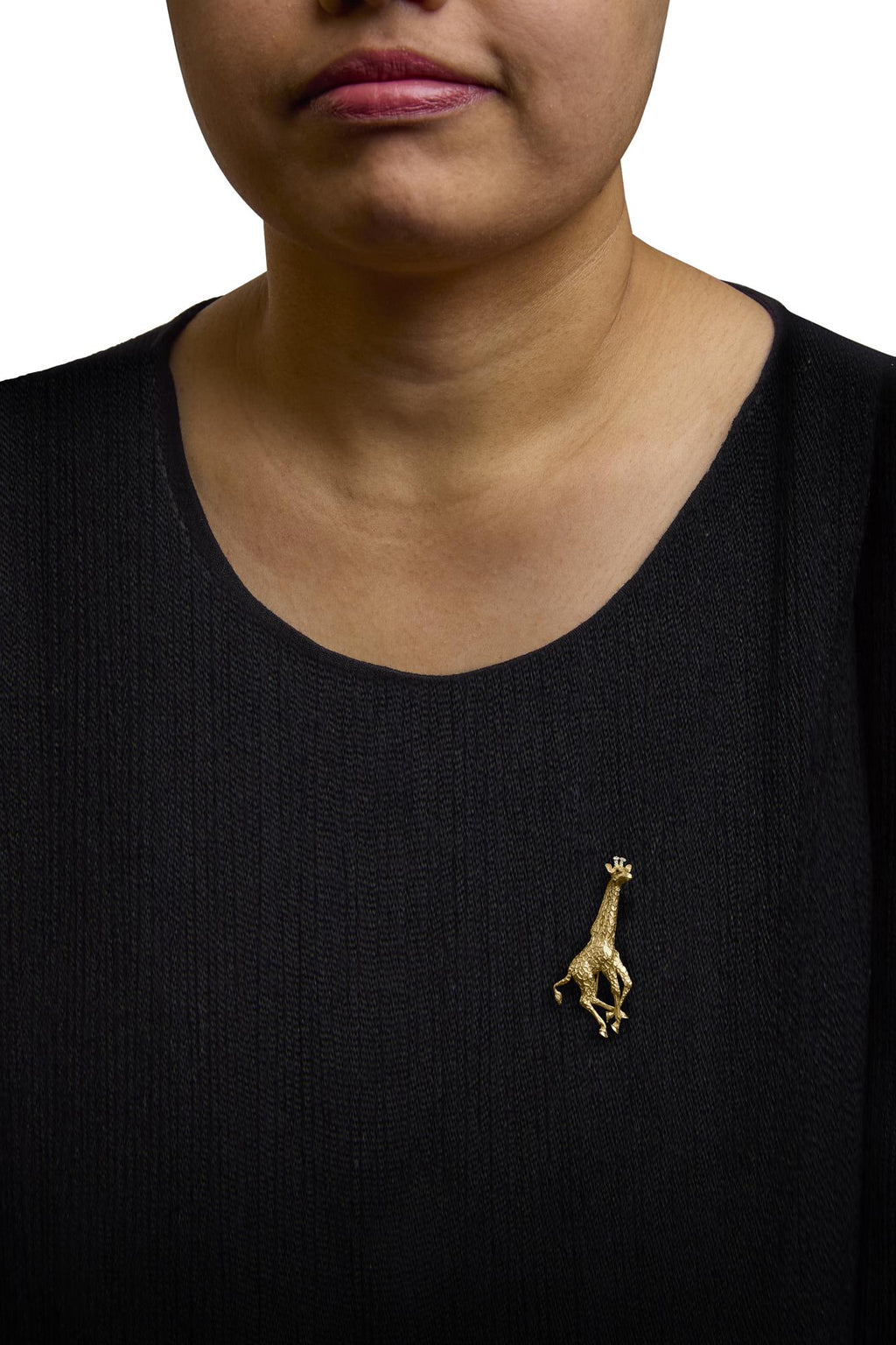 Close-up of diamonds on 18K Yellow Gold Giraffe Brooch with sapphires