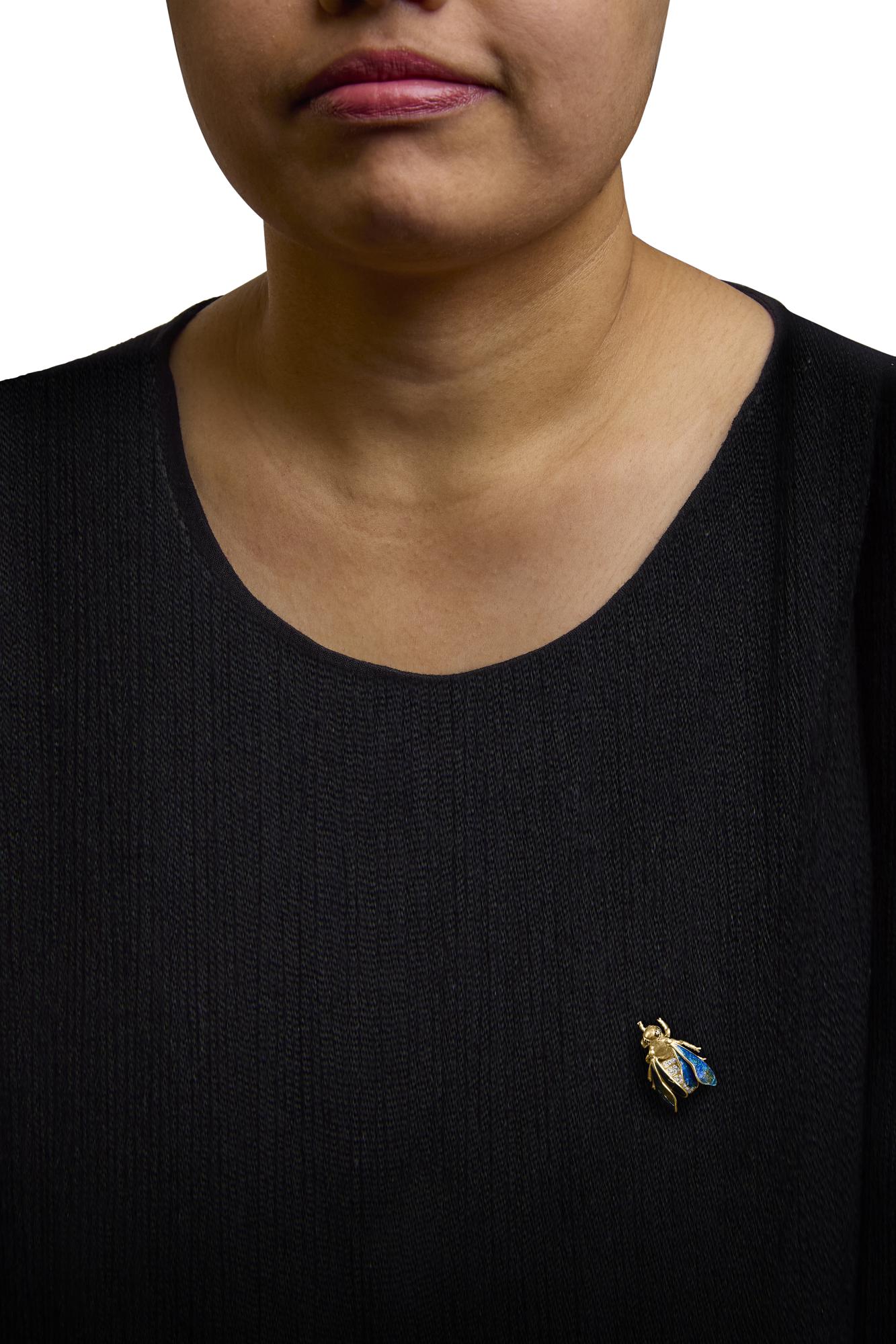 Detailed view of blue-green enamel wings on Bumblebee Brooch Pin