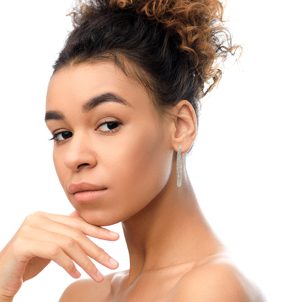 Model wearing 18K Rose Gold Diamond Eternity Hoop Earrings for a glamorous look